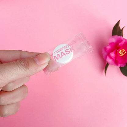 Mascarilla facial desechable de alta gama, no tejida, portátil, comprimida, de 30 o 50 unidades, con pañuelos de algodón envueltos en monedas.